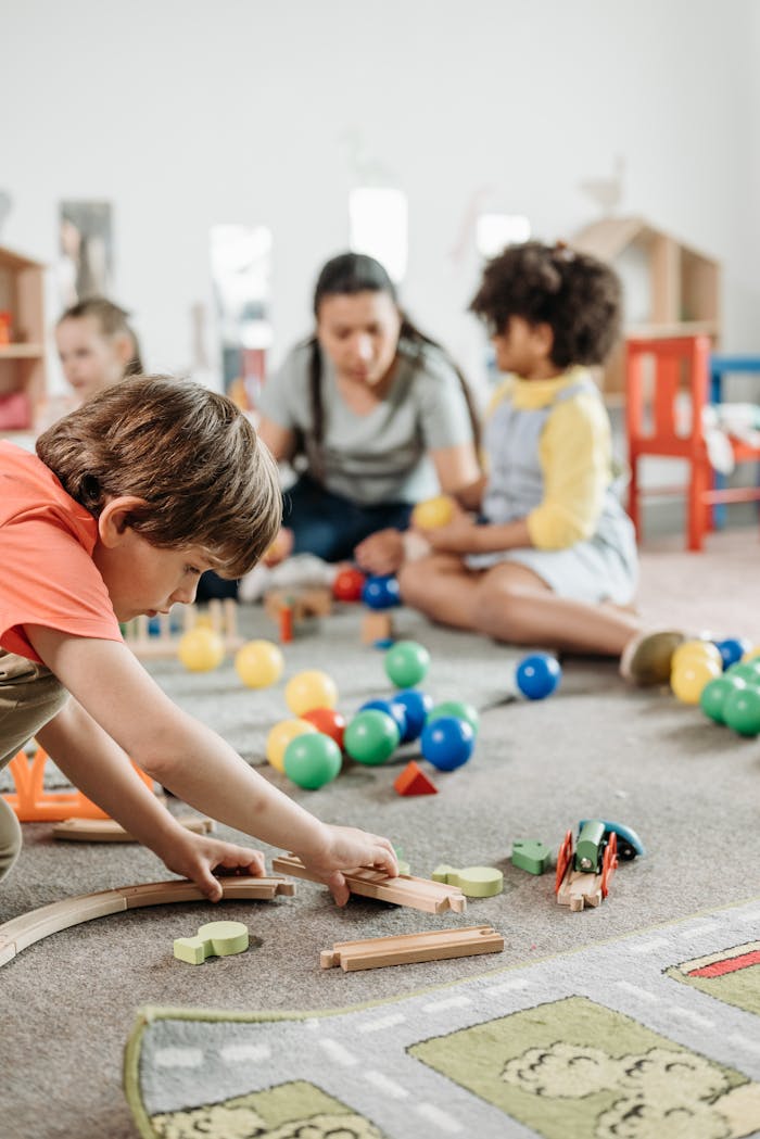 Children interacting with toys in a vibrant kindergarten setting, focusing on creativity and learning.